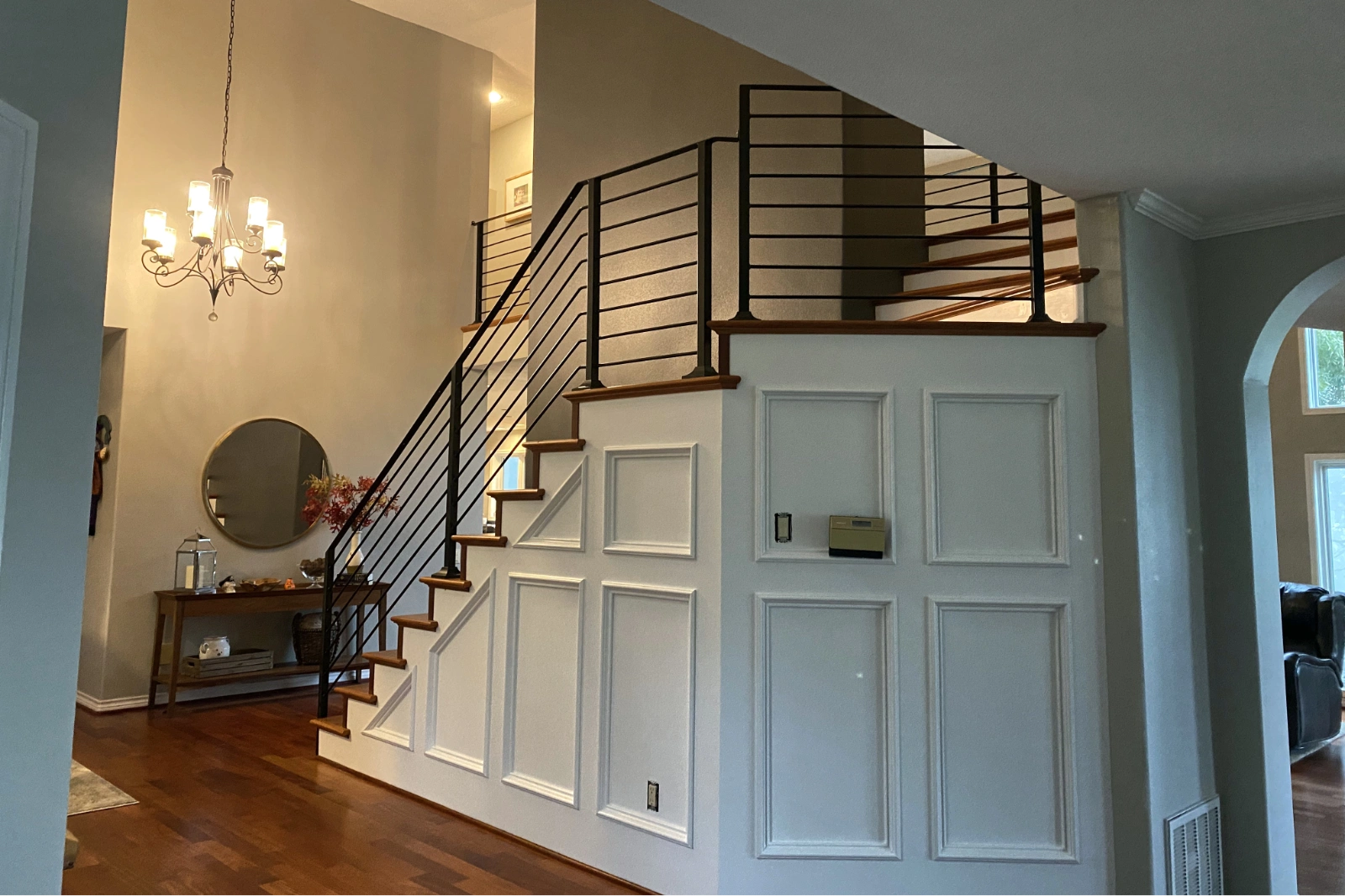 A custom-fabricated matte black metal staircase railing featuring modern horizontal balusters and a sleek handrail.